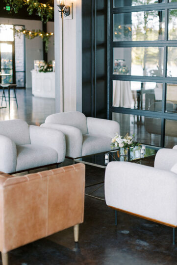 gray and brown leather lounge seating on the lake view event center patio