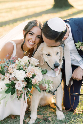 abby and jeff pose with their golden retriever