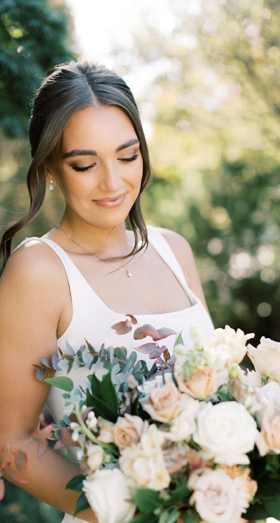 abby bridal portrait holding her pastel bouquet