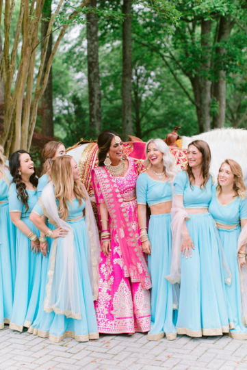Bride Laughing with Bridesmaids in traditional Indian wedding style