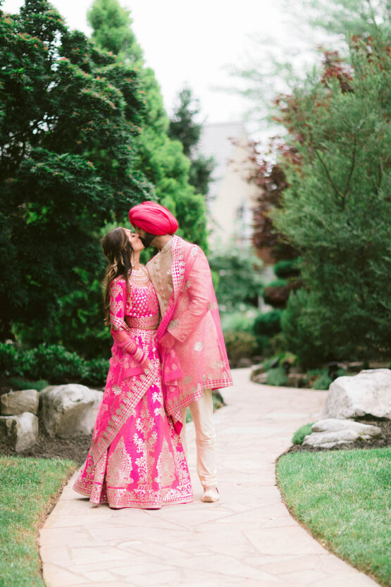 Amber and Sukhbir Kissing in Serenity Gardens