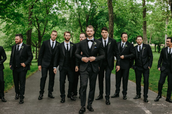 Groomsmen posing for photo in the drive of the estate at cherokee dock