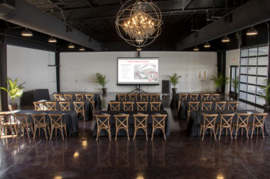 Corporate event setup inside Lakeview Event Center with presentation screen and seating