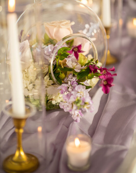 Unique Sphere Glass Terrarium Flower Arrangement for Reception Table Centerpiece Purple Gauze Runner with Taper Candles in Gold Candlesticks