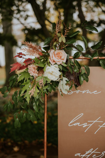 Fall inspired florals on hanging wedding signage