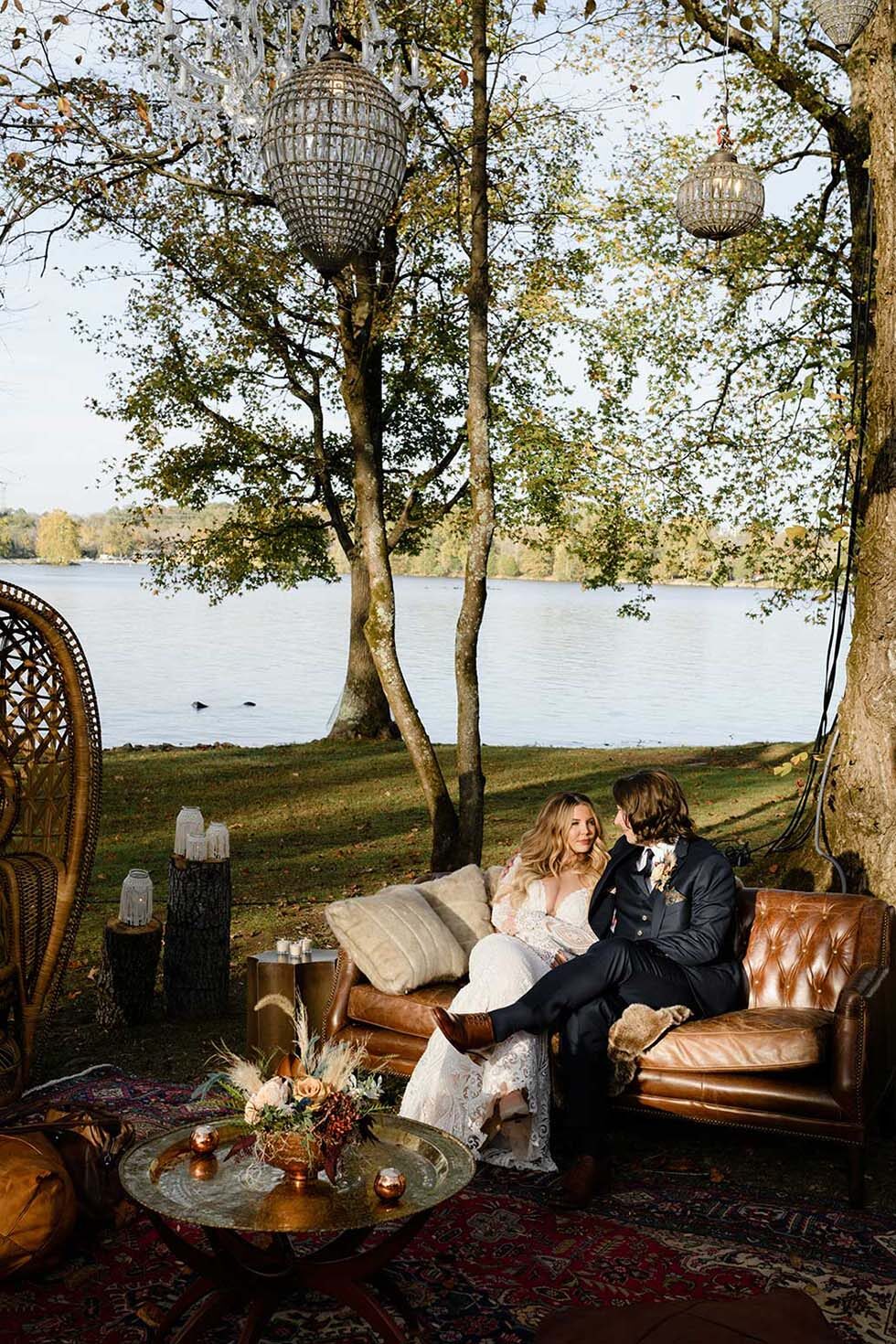 Gray and Billy pose on outdoor lounge area on our Lakeside Lawn