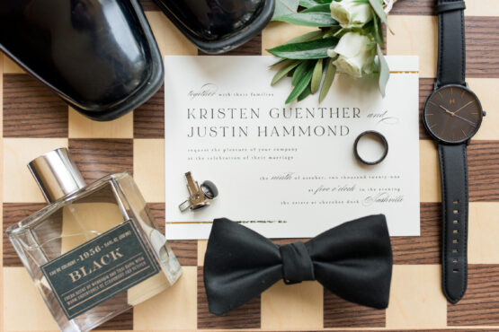 Classic Black and Ivory Wedding Invitation Suite Decorated with Groom's Style Accessories