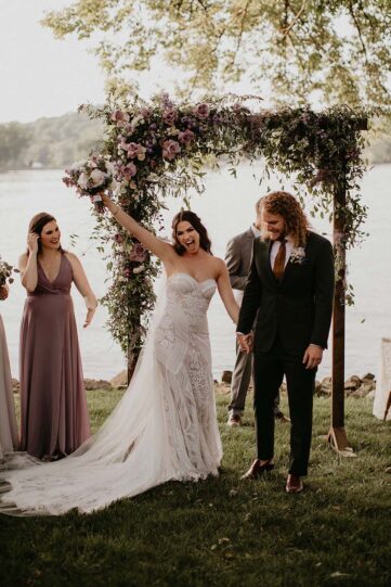 Bride and groom joyfully walk away after their wedding ceremony