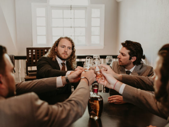 Groomsmen cheers in preparation for the wedding day