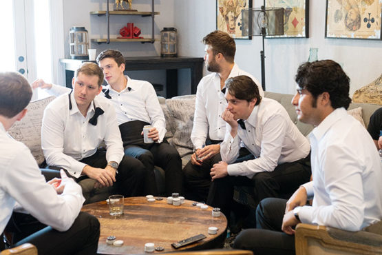 groomsmen gather in the carriage house stables loft