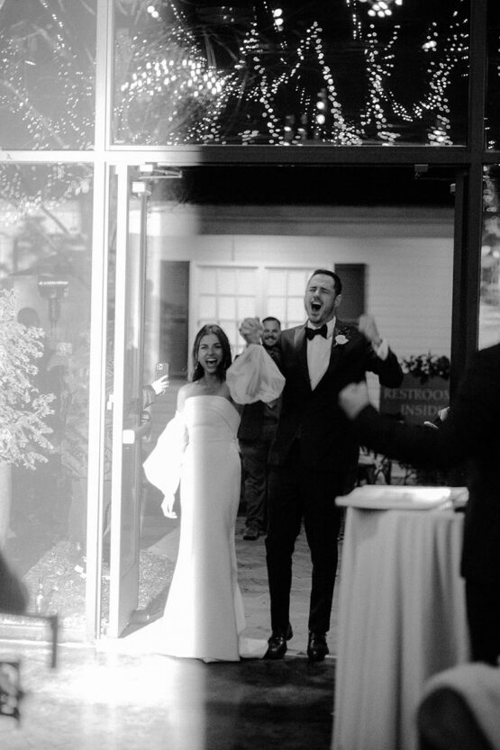 ben and jessica enter their reception in the lakeview event center