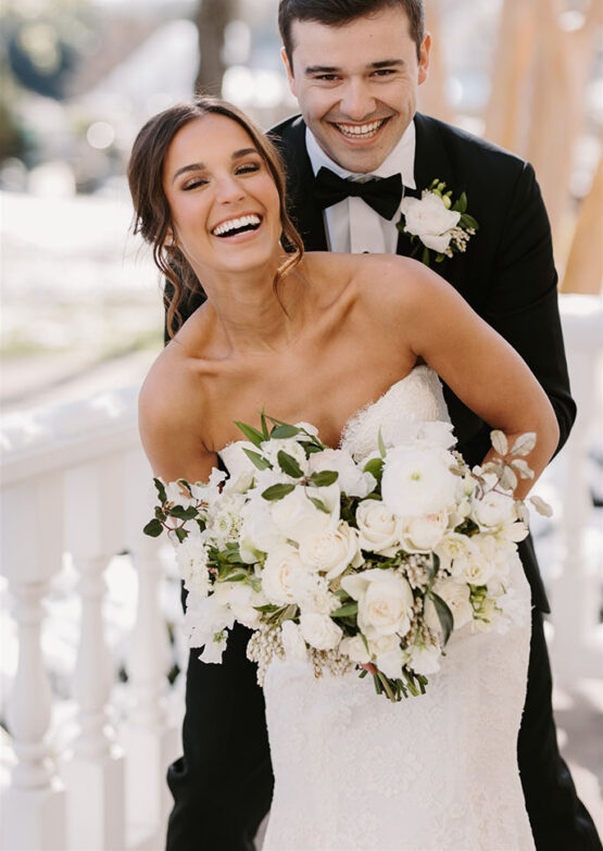 bride and groom embrace for their couple portraits