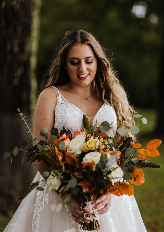 Boho bride with fall themed floral bouquet