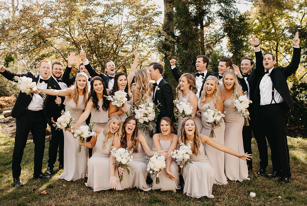 Kristen and Ben Celebrating with Wedding Party