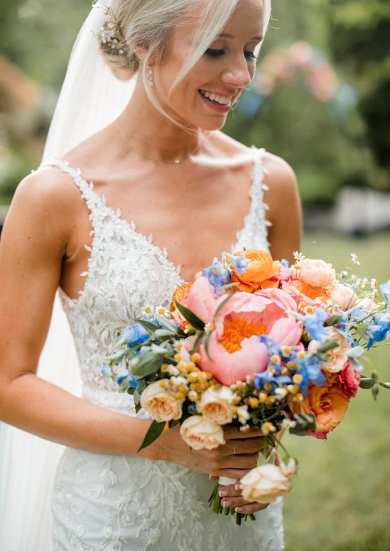 Close up bridal portrait of Mackenzie holding her bouquet
