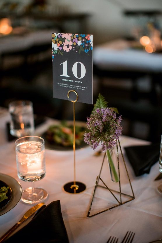 Black table number card with floral detailing