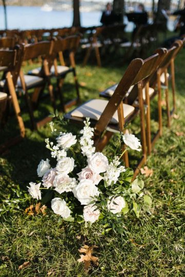 wedding ceremony florals and chairs