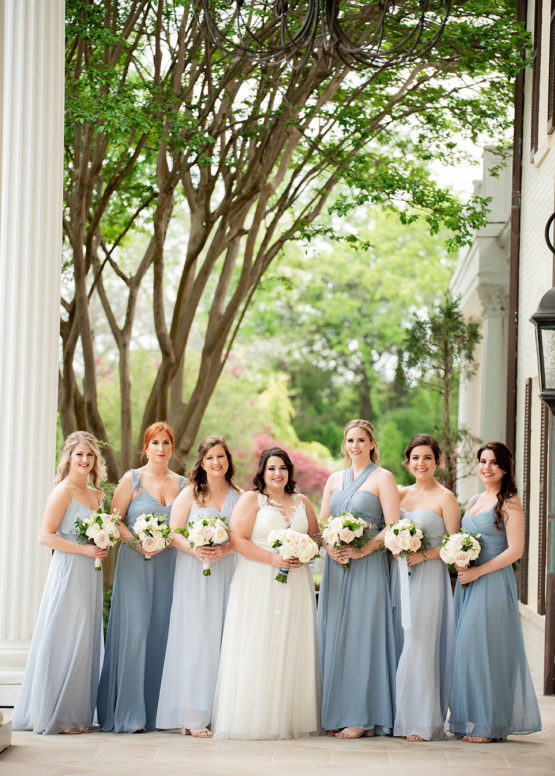 Bridal Party Portrait on Mansion Veranda | Mismatched Bridesmaids in Different Shades of Blue