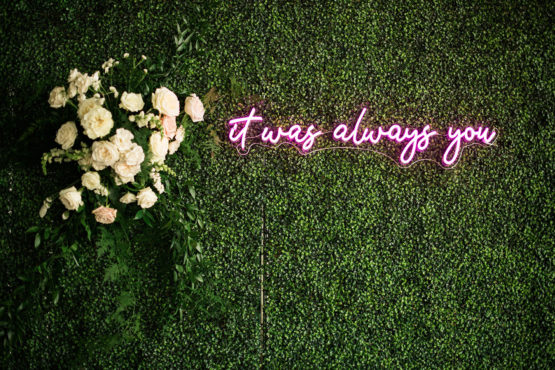 greenery wall with neon sign that ready it was always you