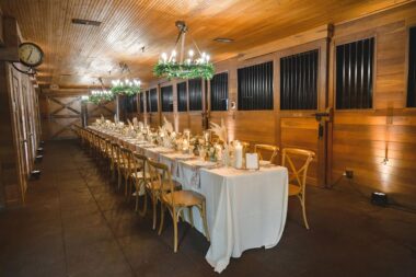 Rehearsal dinner setup inside Carriage House Stables