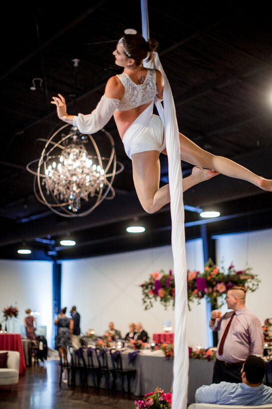 Ribbon aerialist performs during wedding reception