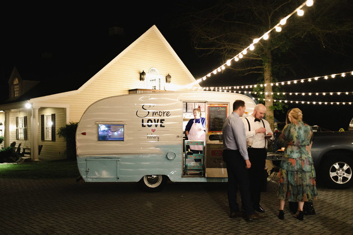 smores truck outside the carriage house stables with hanging string lights