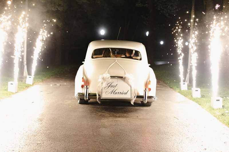vintage getaway car with fireworks