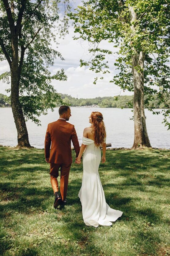 Zoe and Mark Walking by the Lake Holding Hands