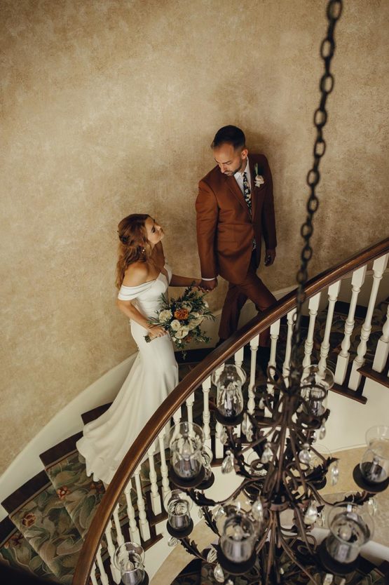 Zoe and Mark Walking Up Staircase in Mansion